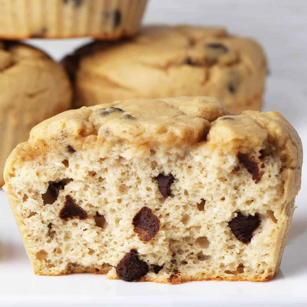 Chocolate chip muffins on a white plate.