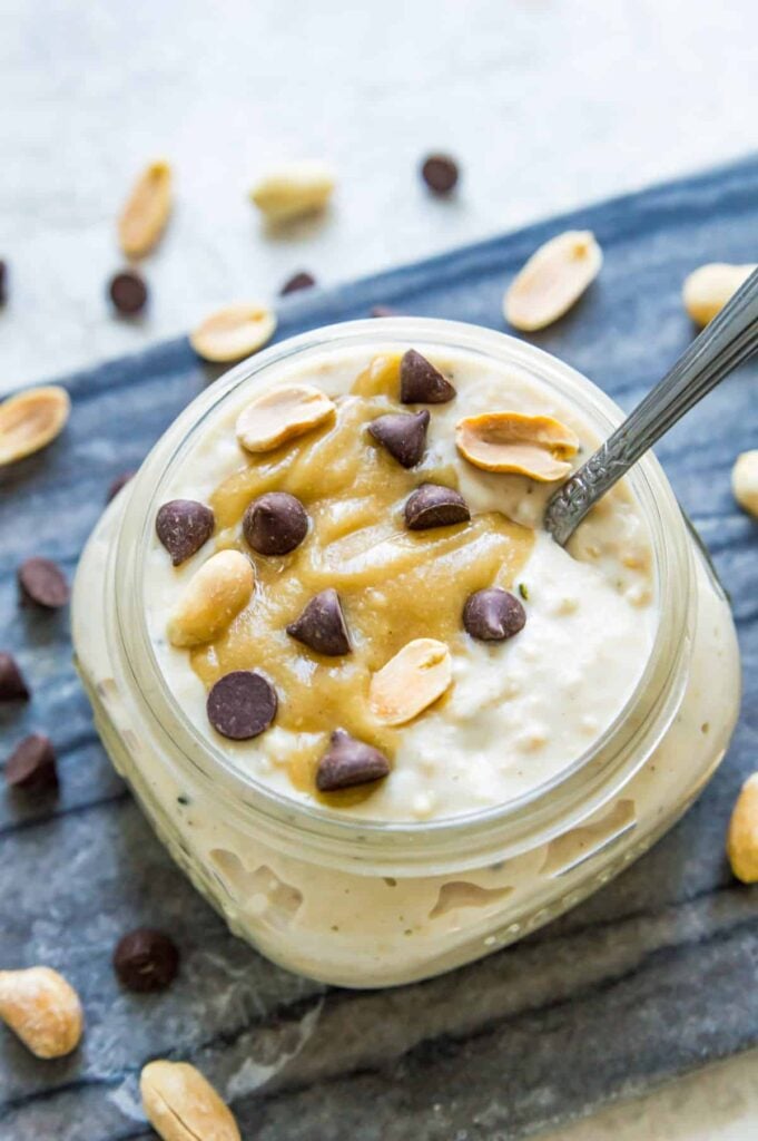 Peanut butter oatmeal in a jar with chocolate chips, providing a high-protein breakfast option.