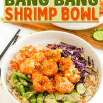 A colorful bowl of rice topped with sauced shrimp, sliced cucumbers, snap peas, shredded carrots, and shredded red cabbage showcases this vibrant bang bang shrimp bowl. The "30 Minute Bang Bang Shrimp Bowl" text appears above the delicious shrimp bowl recipe.