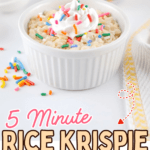 A white ramekin of single serving rice krispie treat topped with whipped cream and rainbow sprinkles sits on a table with more sprinkles scattered nearby. Text reads, “5 Minute Rice Krispie Treat for One.”.