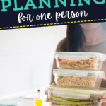 A person holds three stacked containers of prepped meals in a kitchen, illustrating the ease of meal planning for one, with text reading “Meal planning for one person.”.